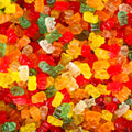 Feestmix met gomberen, colaflesjes, regenboogveters, kikkers en winegums